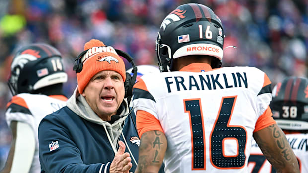 Denver Broncos head coach Sean Payton has a word with wide receiver Troy Franklin (16) in the fourth quarter of an AFC wild c