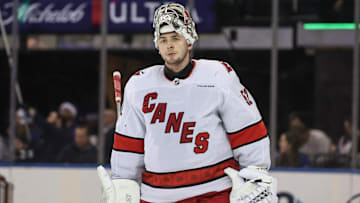 Dec 22, 2024; New York, New York, USA;  Carolina Hurricanes goaltender Pyotr Kochetkov (52) skates back to the bench during a timeout in the third period against the New York Rangers at Madison Square Garden. Mandatory Credit: Wendell Cruz-Imagn Images