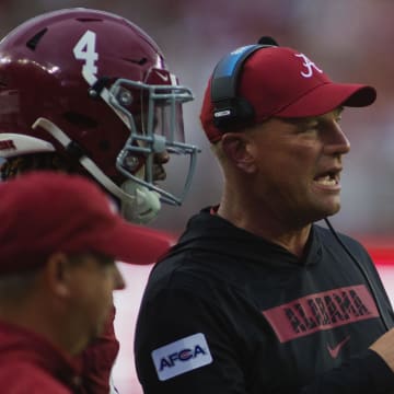 Aug 31, 2024; Tuscaloosa, Alabama, USA;  Alabama Crimson Tide head coach Kalen DeBoer talks to Alabama Crimson Tide quarterback Jalen Milroe (4) after scoring a touchdown against Western Kentucky Hilltoppers during the first quarter at Bryant-Denny Stadium. Mandatory Credit: Will McLelland-USA TODAY Sports