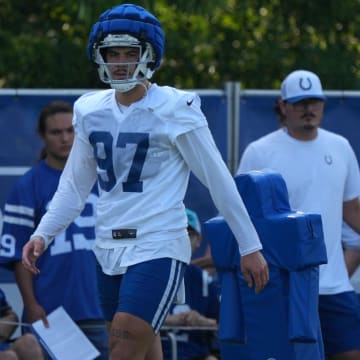 Indianapolis Colts defensive end Laiatu Latu (97) walks across the field during the first day of the Indianapolis Colts’ training camp Thursday, July 25, 2024, at Grand Park Sports Complex in Westfield.