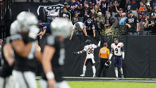 Bears defensive back Jonathan Owens (36) celebrates with fans after the game against the Raiders