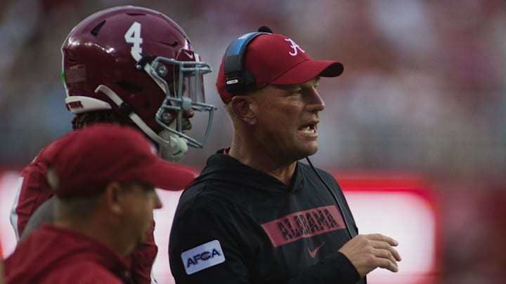 Aug 31, 2024; Tuscaloosa, Alabama, USA;  Alabama Crimson Tide head coach Kalen DeBoer talks to Alabama Crimson Tide quarterback Jalen Milroe (4) after scoring a touchdown against Western Kentucky Hilltoppers during the first quarter at Bryant-Denny Stadium. Mandatory Credit: Will McLelland-Imagn Images