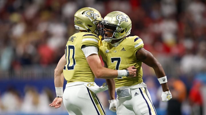 Sep 1, 2023; Atlanta, Georgia, USA; Georgia Tech Yellow Jackets wide receiver Chase Lane (7) celebrates after a touchdown with quarterback Haynes King (10) against the Louisville Cardinals in the second quarter at Mercedes-Benz Stadium. Mandatory Credit: Brett Davis-Imagn Images