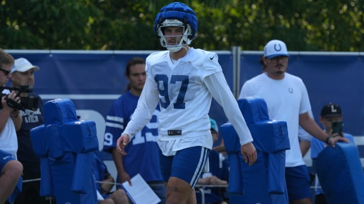 Indianapolis Colts defensive end Laiatu Latu (97) walks across the field during the first day of the Indianapolis Colts’ training camp Thursday, July 25, 2024, at Grand Park Sports Complex in Westfield.