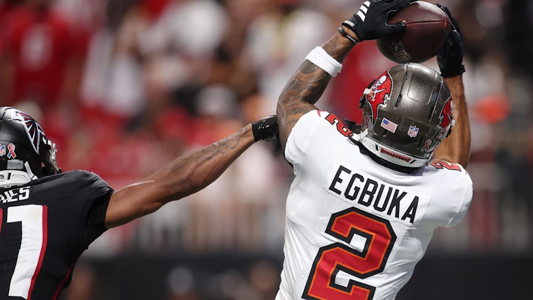 Sep 7, 2025; Atlanta, Georgia, USA; Tampa Bay Buccaneers wide receiver Emeka Egbuka (2) makes a catch against Atlanta Falcons cornerback Mike Hughes (21) for a touchdown during the fourth quarter at Mercedes-Benz Stadium. Mandatory Credit: Brett Davis-Imagn Images