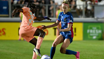 Jun 15, 2024; Cary, North Carolina, USA; Orlando Pride forward Barbra Banda (22) and North Carolina Courage forward Tyler Lussi (14) battle for the ball in the second half at WakeMed Soccer Park. Mandatory Credit: Rob Kinnan-USA TODAY Sports