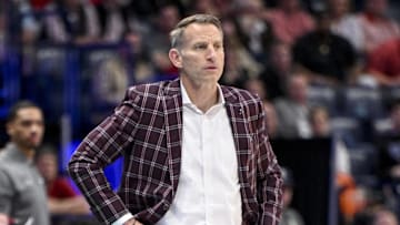 Mar 14, 2025; Nashville, TN, USA;  Alabama Crimson Tide head coach Nate Oats watches his team against the Kentucky Wildcats during the first half at Bridgestone Arena. Mandatory Credit: Steve Roberts-Imagn Images