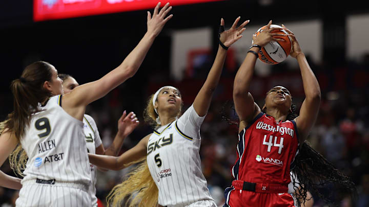 Jul 29, 2025; Washington, District of Columbia, USA; Washington Mystics forward Kiki Iriafen (44) rebounds the ball in front of Chicago Sky forward Angel Reese (5) ad Sky guard Rebecca Allen (9) in the second half at CareFirst Arena. Mandatory Credit: Geoff Burke-Imagn Images