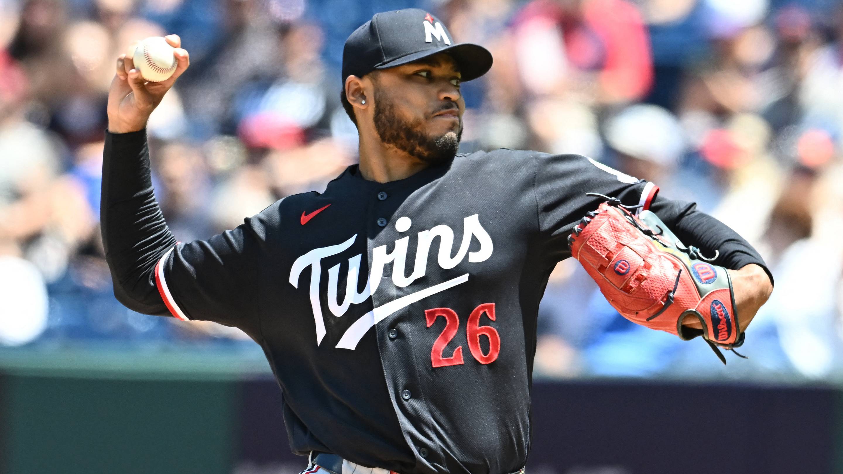 Minnesota Twins starting pitcher Taj Bradley (26) throws a pitch.