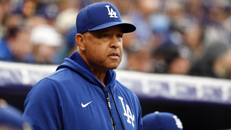 Los Angeles Dodgers manager Dave Roberts looks on from the bench