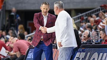 Feb 11, 2023; Auburn, Alabama, USA;  Alabama Crimson Tide head coach Nate Oats and Auburn Tigers head coach Bruce Pearl shake hands before an NCAA basketball game at Neville Arena. Mandatory Credit: Julie Bennett-Imagn Images