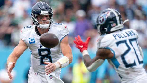 Tennessee Titans quarterback Will Levis (8) pitches to running back Tony Pollard (20) during their game at Nissan Stadium in 