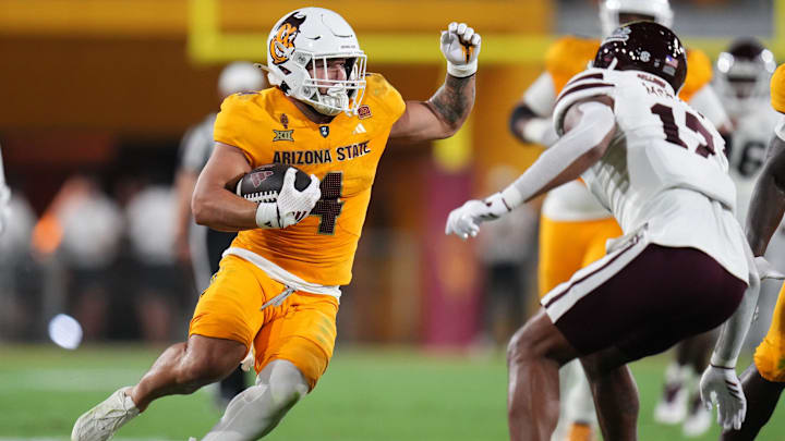 Arizona State running back Cam Skattebo (4) runs the ball against the Mississippi State Bulldogs at Mountain America Stadium in Tempe on Sept. 7, 2024.