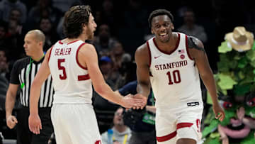 Mar 12, 2025; Charlotte, NC, USA; Stanford Cardinal forward Chisom Okpara (10) reacts with guard Benny Gealer (5) after scoring a basket and being fouled late in the second half at Spectrum Center. Mandatory Credit: Bob Donnan-Imagn Images