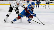 Jan 26, 2024; Denver, Colorado, USA; Colorado Avalanche right wing Logan O'Connor (25) controls the puck ahead of Los Angeles Kings right wing Adrian Kempe (9) in the second period at Ball Arena. Mandatory Credit: Isaiah J. Downing-Imagn Images