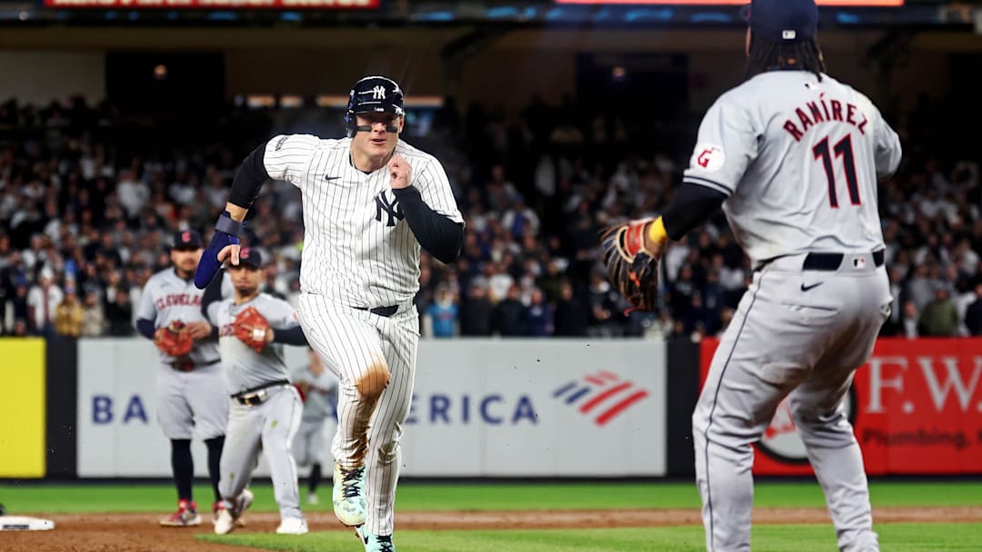 Oct 15, 2024; Bronx, New York, USA; New York Yankees first base Anthony Rizzo (48) is caught in a pickle during the sixth inning against the Cleveland Guardians in game two of the ALCS for the 2024 MLB Playoffs at Yankee Stadium. Mandatory Credit: Vincent Carchietta-Imagn Images