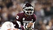 Nov 30, 2024; College Station, Texas, USA; Texas A&M Aggies quarterback Marcel Reed (10) calls a play during the first quarter against the Texas Longhorns. The Longhorns defeated the Aggies 17-7 at Kyle Field. Mandatory Credit: Maria Lysaker-Imagn Images  