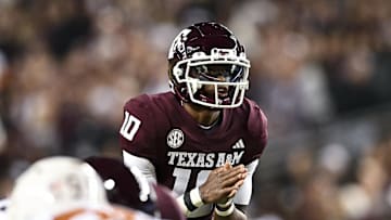 Nov 30, 2024; College Station, Texas, USA; Texas A&M Aggies quarterback Marcel Reed (10) calls a play during the first quarter against the Texas Longhorns. The Longhorns defeated the Aggies 17-7 at Kyle Field. Mandatory Credit: Maria Lysaker-Imagn Images  