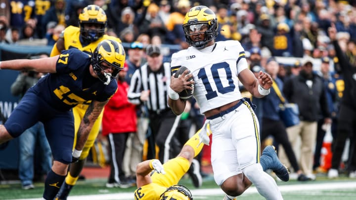 Blue Team quarterback Alex Orji (10) runs for a touchdown against Maize Team during the first half of the spring game at Michigan Stadium in Ann Arbor on Saturday, April 20, 2024.