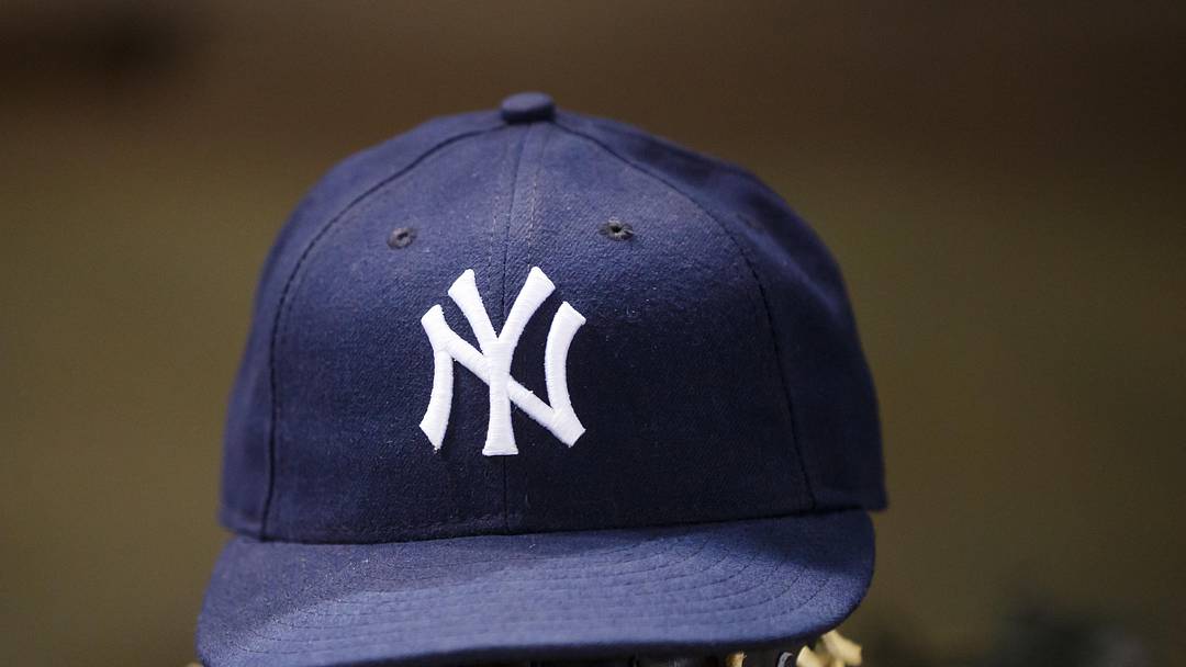 May 18, 2016; Phoenix, AZ, USA; Detailed view of a New York Yankees hat and baseball glove against the Arizona Diamondbacks at Chase Field. Mandatory Credit: Mark J. Rebilas-Imagn Images