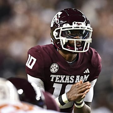 Nov 30, 2024; College Station, Texas, USA; Texas A&M Aggies quarterback Marcel Reed (10) calls a play during the first quarter against the Texas Longhorns. The Longhorns defeated the Aggies 17-7 at Kyle Field. Mandatory Credit: Maria Lysaker-Imagn Images  