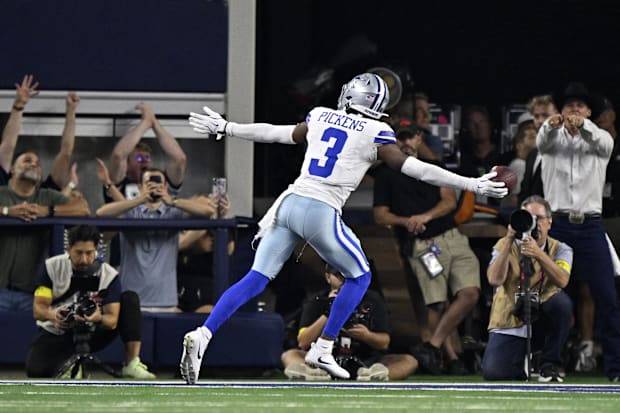 Dallas Cowboys wide receiver George Pickens celebrates after scoring a touchdown against the Green Bay Packers.
