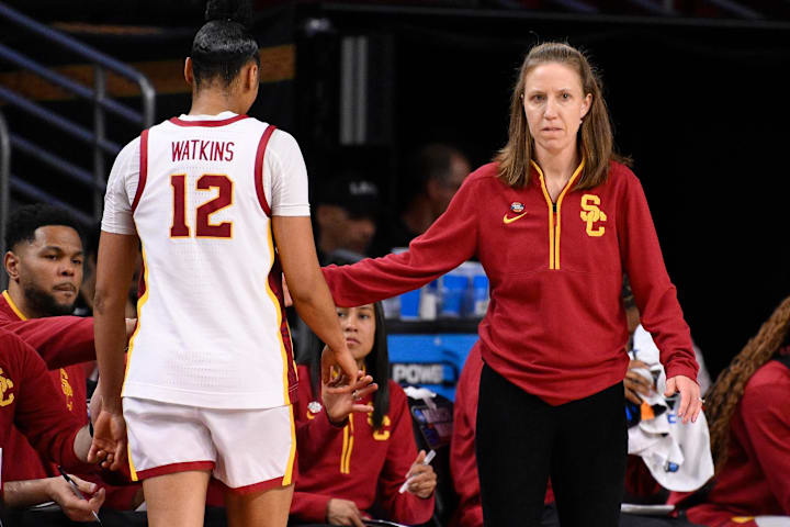 USC Trojans head coach Lindsay Gottlieb greets guard JuJu Watkins against the UNC Greensboro Spartans.