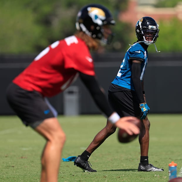 Jacksonville Jaguars wide receiver Travis Hunter (12) looks to quarterback Trevor Lawrence (16) during the 10th organized tea