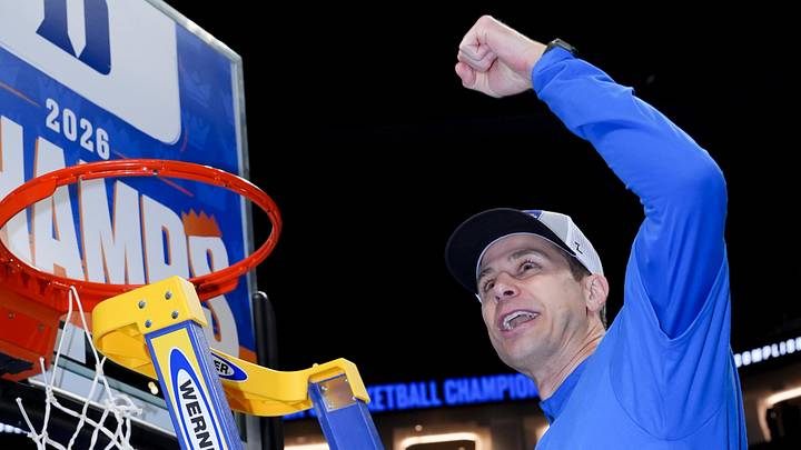 Mar 14, 2026; Charlotte, NC, USA; Duke Blue Devils head coach Jon Scheyer cuts down the net after defeating the Virginia Cavaliers in the men's ACC Conference Tournament Championship at Spectrum Center. Mandatory Credit: Jim Dedmon-Imagn Images
