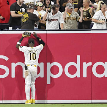 Sep 5, 2024; San Diego, California, USA; San Diego Padres left fielder Jurickson Profar (10) watches a grand slam hit by Detroit Tigers center fielder Parker Meadows (not pictured) go over the wall during the ninth inning at Petco Park. Mandatory Credit: Denis Poroy-Imagn Images