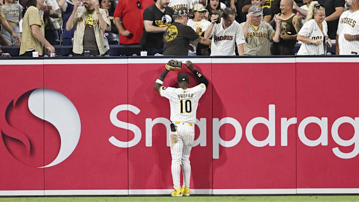 Sep 5, 2024; San Diego, California, USA; San Diego Padres left fielder Jurickson Profar (10) watches a grand slam hit by Detroit Tigers center fielder Parker Meadows (not pictured) go over the wall during the ninth inning at Petco Park. Mandatory Credit: Denis Poroy-Imagn Images