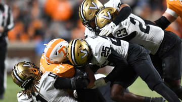 Tennessee tight end McCallan Castles (34) is taken down by the Vanderbilt defense during an NCAA college football game on Saturday, November 25, 2023 in Knoxville, Tenn.