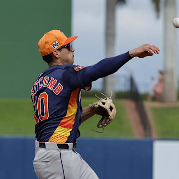 Feb 26, 2025; West Palm Beach, Florida, USA; Houston Astros shortstop Shay Whitcomb (10) throws a jump ball to first base during the fourth inning against the Washington Nationals at CACTI Park of the Palm Beaches.