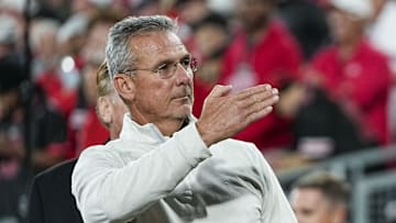 Former Ohio State Buckeyes head coach Urban Meyer salutes the fans chanting his name during the College Football Playoff quarterfinal against the Oregon Ducks at the Rose Bowl in Pasadena, Calif. on Jan. 1, 2025. Ohio State won 41-21.