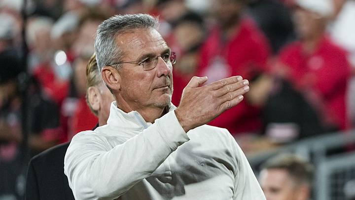 Former Ohio State Buckeyes head coach Urban Meyer salutes the fans chanting his name during the College Football Playoff quarterfinal against the Oregon Ducks at the Rose Bowl in Pasadena, Calif. on Jan. 1, 2025. Ohio State won 41-21.