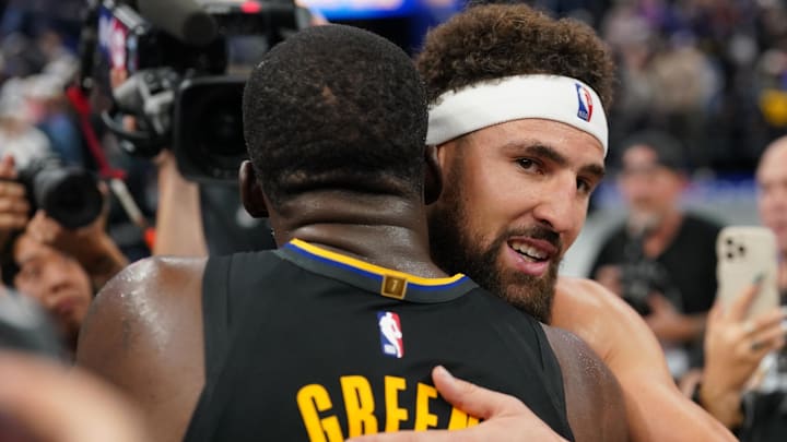 Nov 12, 2024; San Francisco, California, USA; Dallas Mavericks guard Klay Thompson (31) hugs Golden State Warriors forward Draymond Green (23) after a game at the Chase Center. Mandatory Credit: Cary Edmondson-Imagn Images
