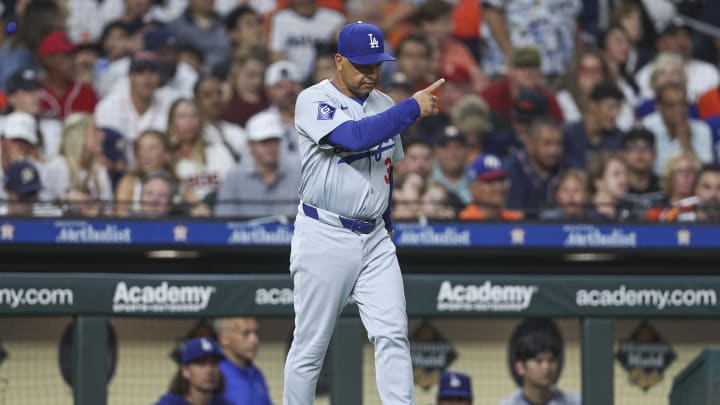 Jul 27, 2024; Houston, Texas, USA; Los Angeles Dodgers manager Dave Roberts (30) motions for a pitching change during the sixth inning against the Houston Astros at Minute Maid Park. Mandatory Credit: Troy Taormina-USA TODAY Sports