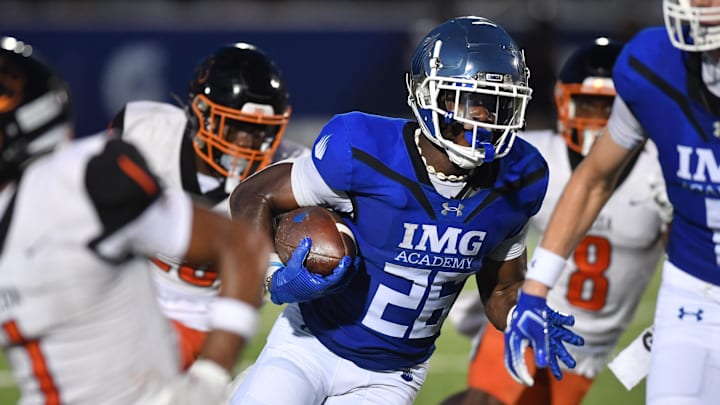 IMG Academy running back Donovan Johnson (#26) weaves his way through Cocoa High defenders on his way to the end zone in the second quarter. The IMG Academy National squad hosted the Cocoa High School Tigers Friday, Sept. 6, 2024 in Bradenton. IMG Academy running back Donovan Johnson (#26) weaves his way through Cocoa High defenders on his way to the end zone in the second quarter. The IMG Academy National squad hosted the Cocoa High School Tigers Friday, Sept. 6, 2024 in Bradenton.