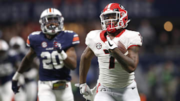 Dec 2, 2017; Atlanta, GA, USA; Georgia Bulldogs running back D'Andre Swift (7) runs for a touchdown against Auburn Tigers defensive back Jeremiah Dinson (20) during the fourth quarter of the SEC Championship game at Mercedes-Benz Stadium. Mandatory Credit: Brett Davis-Imagn Images