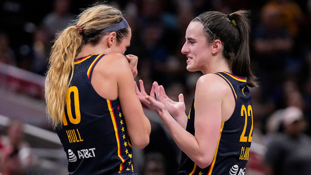 Indiana Fever guard Caitlin Clark (22) and Indiana Fever guard Lexie Hull (10) talk during a timeout on Sunday, Sept. 15, 2024, during the game at Gainbridge Fieldhouse in Indianapolis. The Indiana Fever defeated the Dallas Wings, 110-109.