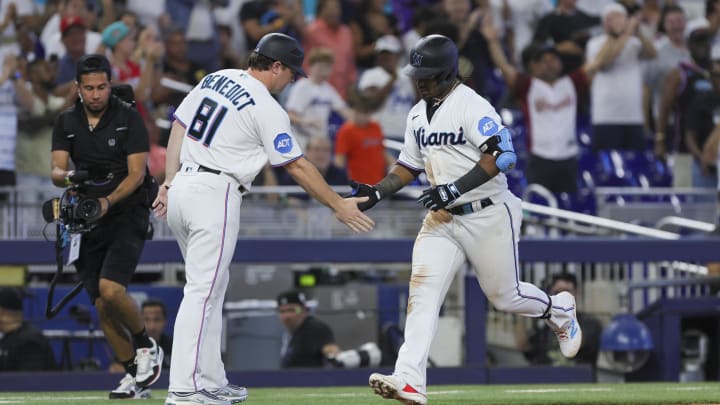 Jul 30, 2023; Miami, Florida, USA; Miami Marlins third baseman Jean Segura (9) celebrates with third base coach Griffin Benedict (81) after hitting a home run against the Detroit Tigers during the eighth inning at loanDepot Park. 