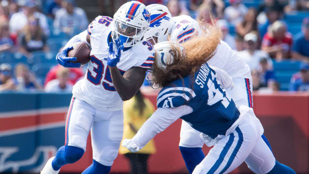 Aug 12, 2023; Buffalo Bills running back Jordan Mims (35) evades Indianapolis Colts linebacker Grant Stuard (41) 