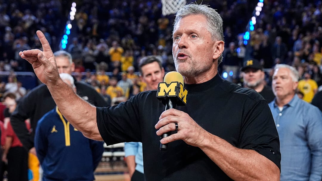Michigan football head coach Kyle Whittingham speaks as he is being introduced on the floor during the first half between Michigan and USC at Crisler Center in Ann Arbor on Friday, Jan. 2, 2026.