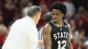 Mississippi State Bulldogs coach Chris Jans talks to guard Josh Hubbard (12) during the first half against the Arkansas Razorbacks at Bud Walton Arena.