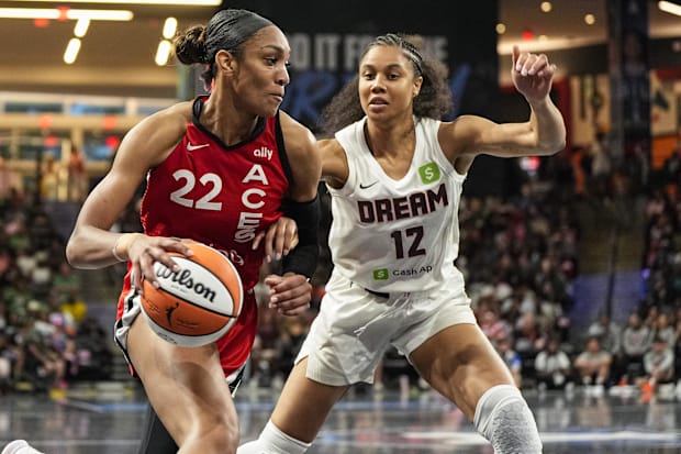 Las Vegas Aces center A'ja Wilson (22) dribbles against Atlanta Dream forward Nia Coffey (12)