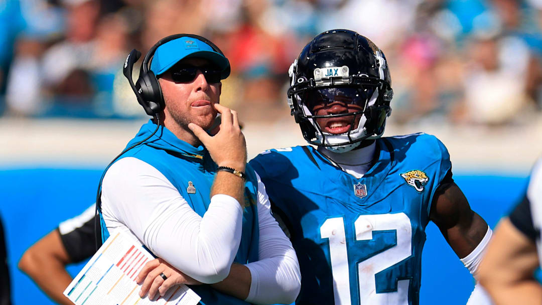 Jacksonville Jaguars head coach Liam Coen looks to the video scoreboard with wide receiver Travis Hunter (12) during the fourth quarter of an NFL football matchup, Sunday, Oct. 12, 2025, at EverBank Stadium in Jacksonville, Fla. The Seahawks defeated the Jaguars 20-12. [Corey Perrine/Florida Times-Union]