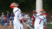 Payton Cormier and Connor Shellenberger celebrate after Cormier scored during the Virginia men's lacrosse game against St. Joe's in the first round of the NCAA Men's Lacrosse Championship at Klockner Stadium.