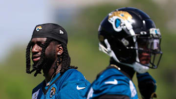 Jacksonville Jaguars wide receiver Brian Thomas Jr. (7) walks by wide receiver Travis Hunter (12) during the 10th organized team activity at Miller Electric Center Wednesday, June 4, 2025 in Jacksonville, Fla. [Corey Perrine/Florida Times-Union]