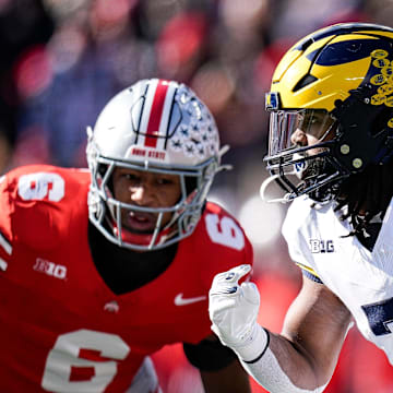 Michigan running back Donovan Edwards (7) runs against Ohio State during the first half at Ohio Stadium in Columbus, Ohio on Saturday, Nov. 30, 2024.