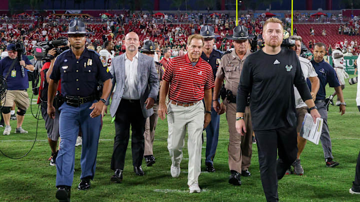 Sep 16, 2023; Tampa, Florida, USA;  Alabama Crimson Tide head coach Nick Saben and South Florida Bulls head coach Alex Golesh walk of the field after a game at Raymond James Stadium. Mandatory Credit: Nathan Ray Seebeck-USA TODAY Sports